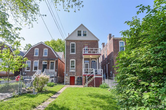4207 Connecticut St, Saint Louis, MO 63116 - rear view of house with brick siding, a balcony, and stairway