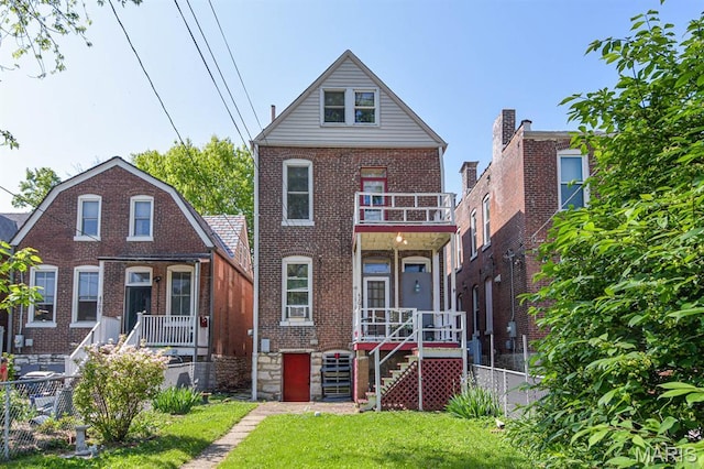4207 Connecticut St, Saint Louis, MO 63116 - back of property featuring brick siding, a balcony, and stairway
