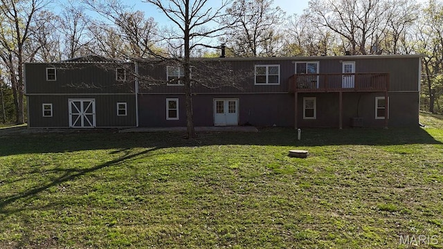 8325 Maple Ln, Dittmer, MO 63023 - rear view of house featuring a yard, central AC unit, and a wooden deck