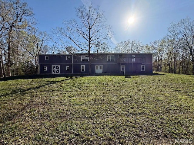 8325 Maple Ln, Dittmer, MO 63023 - rear view of house featuring a lawn