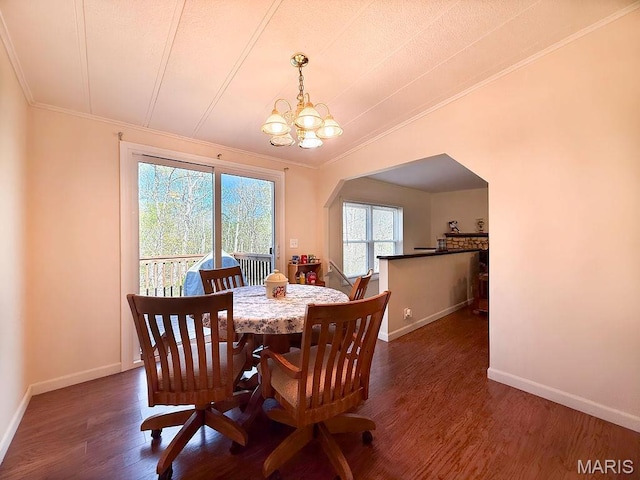 8325 Maple Ln, Dittmer, MO 63023 - dining area featuring crown molding, a chandelier, dark wood-type flooring, and baseboards