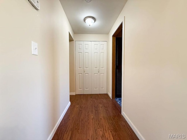 8325 Maple Ln, Dittmer, MO 63023 - corridor featuring dark wood-style flooring and baseboards