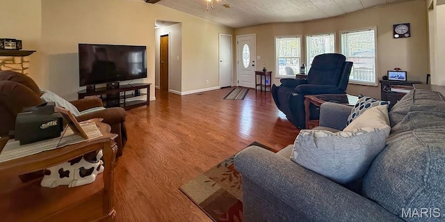 8325 Maple Ln, Dittmer, MO 63023 - living room featuring wood finished floors, vaulted ceiling, and baseboards