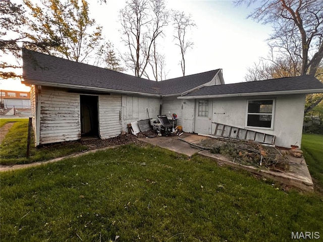 410 N Jackson St, Farmington, MO 63640 - back of property with a lawn and a patio