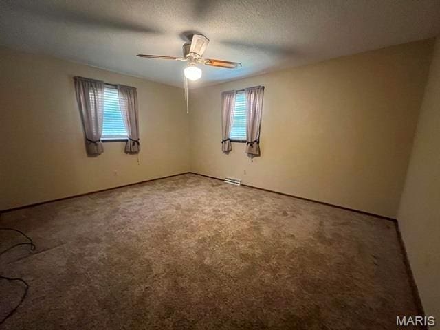 11799 County Road 637, Dexter, MO 63841 - unfurnished room featuring healthy amount of natural light, ceiling fan, and carpet flooring