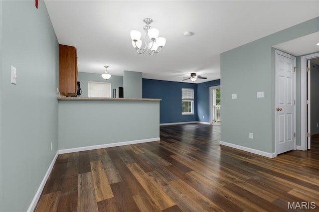 9744 Bexley Station Dr Unit F, Saint Louis, MO 63123 - unfurnished living room with a chandelier, dark wood-style flooring, and ceiling fan