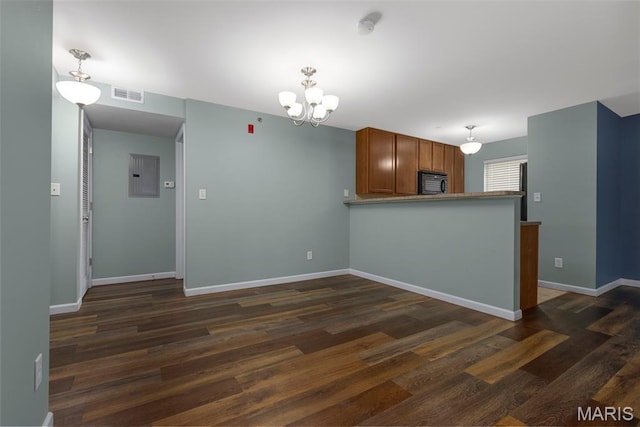 9744 Bexley Station Dr Unit F, Saint Louis, MO 63123 - kitchen featuring electric panel, dark wood-style floors, a chandelier, and brown cabinetry