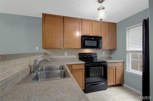 9744 Bexley Station Dr Unit F, Saint Louis, MO 63123 - kitchen with black appliances, backsplash, light countertops, and light tile patterned flooring