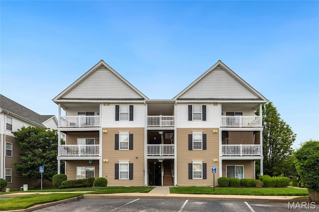 9744 Bexley Station Dr Unit F, Saint Louis, MO 63123 - view of building exterior with uncovered parking