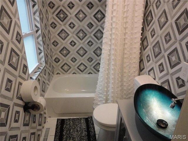 6518 Chamberlain Ave, Saint Louis, MO 63130 - full bathroom with toilet, shower / bath combo with shower curtain, and vanity