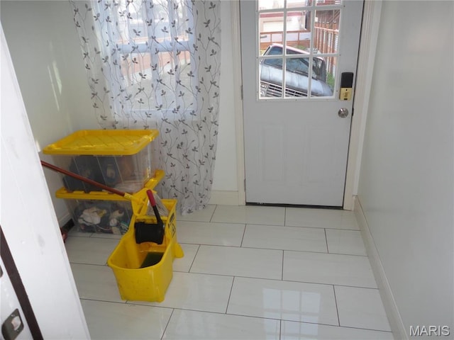 6518 Chamberlain Ave, Saint Louis, MO 63130 - doorway featuring tile patterned floors and baseboards