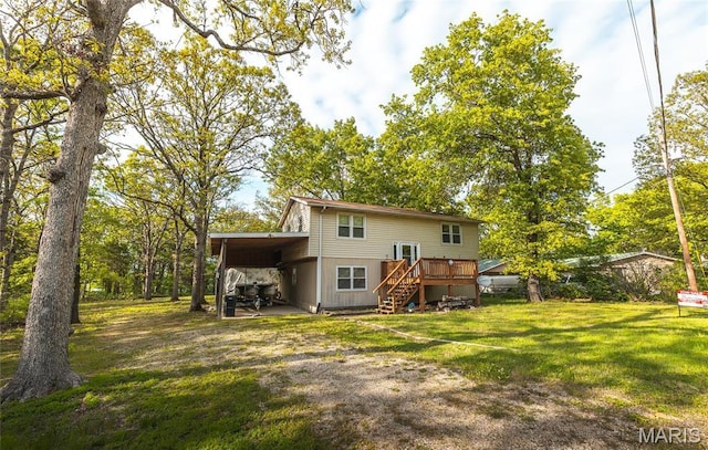 1109 Pawnee Dr, Cuba, MO 65453 - back of house with stairway, a lawn, an attached carport, a deck, and driveway