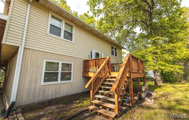 1109 Pawnee Dr, Cuba, MO 65453 - back of property with stairway and a wooden deck