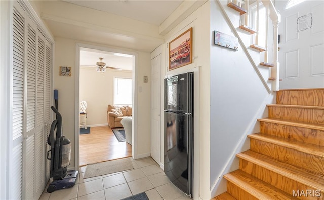 1109 Pawnee Dr, Cuba, MO 65453 - staircase featuring tile patterned flooring and a ceiling fan