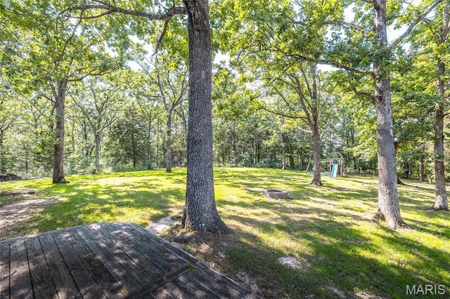 1109 Pawnee Dr, Cuba, MO 65453 - view of green lawn featuring a playground and a wooden deck