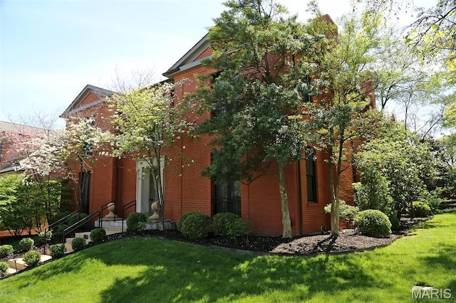 7788 Pershing Ave, Clayton, MO 63105 - view of property exterior with a yard and brick siding