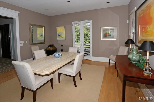 7788 Pershing Ave, Clayton, MO 63105 - dining area with french doors, light wood-type flooring, and baseboards