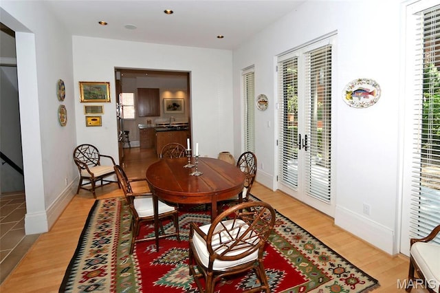7788 Pershing Ave, Clayton, MO 63105 - dining area with light wood finished floors, recessed lighting, and baseboards
