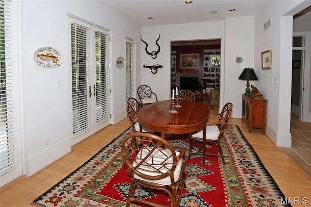 7788 Pershing Ave, Clayton, MO 63105 - dining space with light wood-style flooring, recessed lighting, french doors, and baseboards