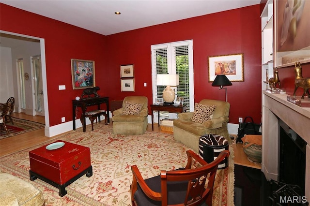 7788 Pershing Ave, Clayton, MO 63105 - living room featuring wood finished floors, a high end fireplace, and baseboards