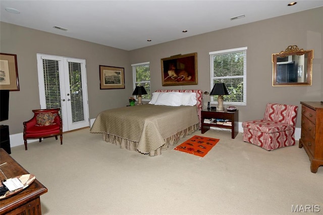 7788 Pershing Ave, Clayton, MO 63105 - carpeted bedroom featuring access to outside, multiple windows, french doors, and baseboards