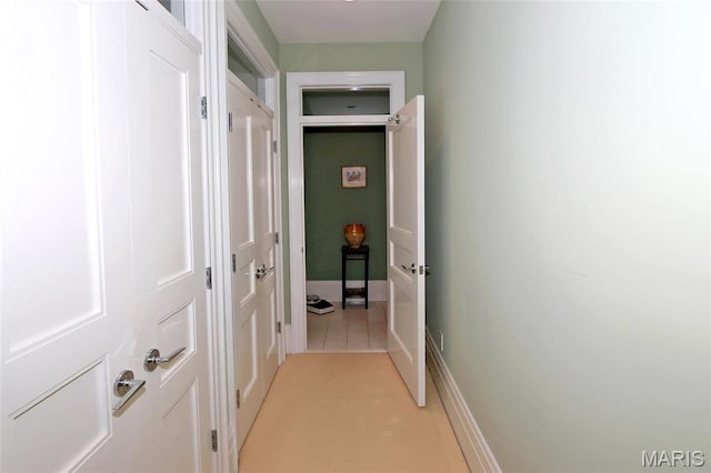 7788 Pershing Ave, Clayton, MO 63105 - corridor with light colored carpet and baseboards