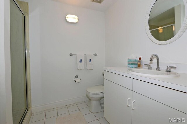 7788 Pershing Ave, Clayton, MO 63105 - bathroom with tile patterned floors, toilet, a shower with shower door, vanity, and baseboards