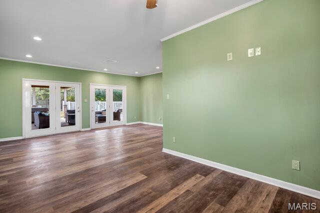 433 Snipes Dr, Saint Charles, MO 63303 - unfurnished living room featuring french doors, ornamental molding, recessed lighting, dark wood-style floors, and ceiling fan