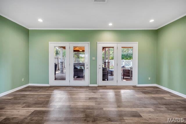 433 Snipes Dr, Saint Charles, MO 63303 - empty room featuring french doors, crown molding, wood finished floors, and recessed lighting