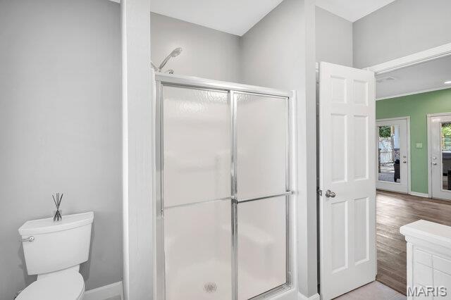 433 Snipes Dr, Saint Charles, MO 63303 - full bathroom featuring a shower stall and wood finished floors