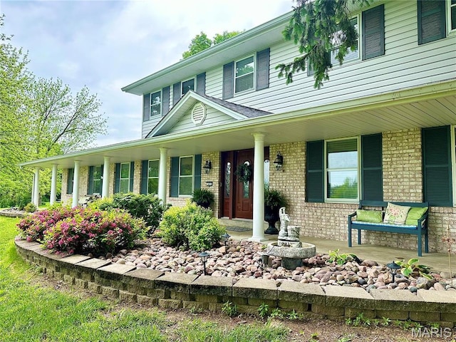 433 Snipes Dr, Saint Charles, MO 63303 - farmhouse inspired home with brick siding and covered porch