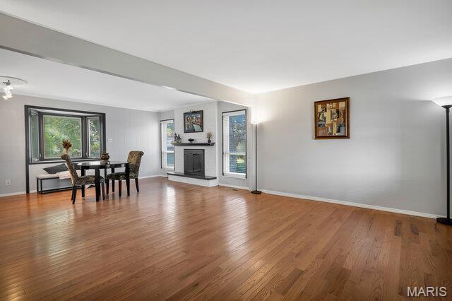 433 Snipes Dr, Saint Charles, MO 63303 - living room featuring wood finished floors and a large fireplace