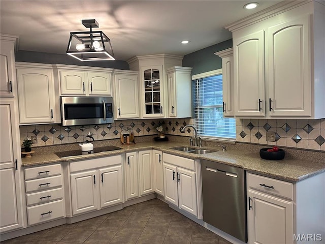 433 Snipes Dr, Saint Charles, MO 63303 - kitchen with appliances with stainless steel finishes, decorative backsplash, dark tile patterned flooring, and recessed lighting