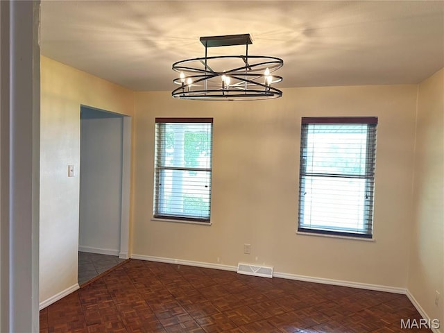 433 Snipes Dr, Saint Charles, MO 63303 - spare room featuring a chandelier and baseboards