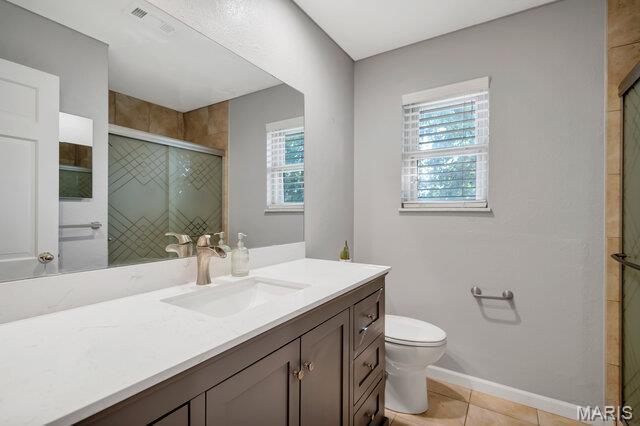 433 Snipes Dr, Saint Charles, MO 63303 - bathroom with vanity, a shower stall, and tile patterned flooring