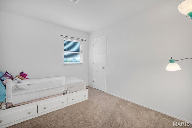 433 Snipes Dr, Saint Charles, MO 63303 - unfurnished bedroom featuring carpet floors and baseboards