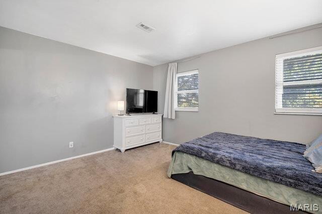 433 Snipes Dr, Saint Charles, MO 63303 - carpeted bedroom with baseboards