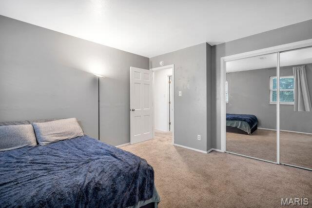 433 Snipes Dr, Saint Charles, MO 63303 - carpeted bedroom with baseboards and a closet