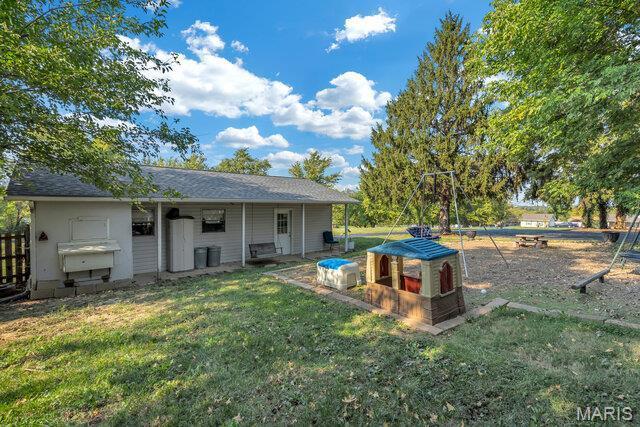 433 Snipes Dr, Saint Charles, MO 63303 - rear view of property with a lawn