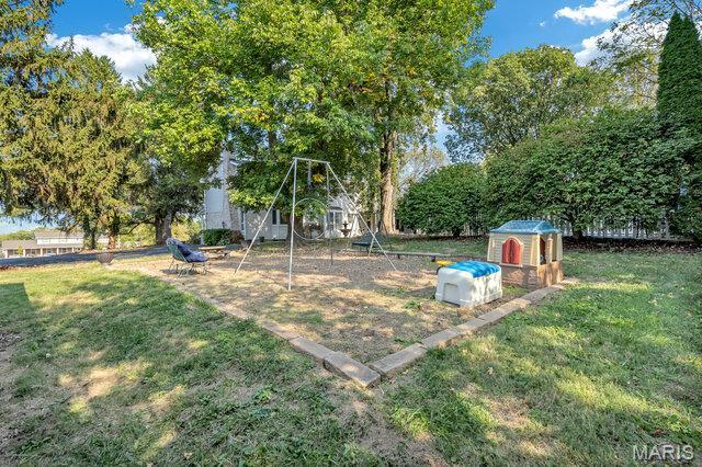 433 Snipes Dr, Saint Charles, MO 63303 - view of grassy yard with exterior structure and an outdoor structure