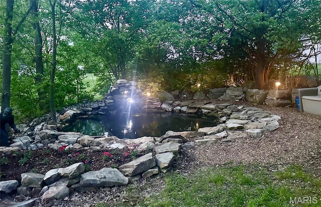 433 Snipes Dr, Saint Charles, MO 63303 - view of yard with a garden pond