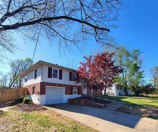 view of front facade featuring brick siding, a garage, fence, and concrete driveway