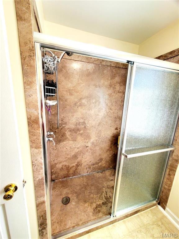 bathroom featuring a shower stall