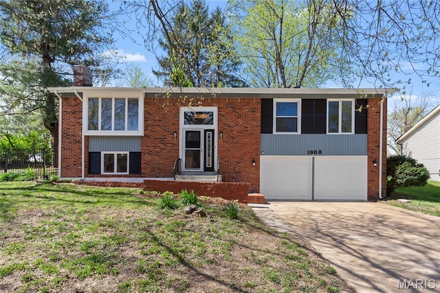 1958 Cathedral Hill Dr, Saint Louis, MO 63138 - bi-level home with a garage, concrete driveway, brick siding, and a chimney
