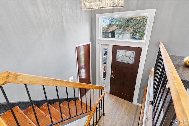 1958 Cathedral Hill Dr, Saint Louis, MO 63138 - foyer entrance with a chandelier, light wood-style floors, a towering ceiling, and stairs