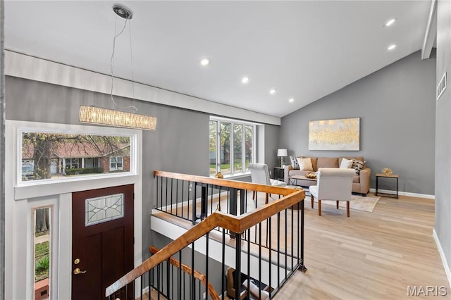 1958 Cathedral Hill Dr, Saint Louis, MO 63138 - foyer with high vaulted ceiling, recessed lighting, baseboards, light wood finished floors, and stairway