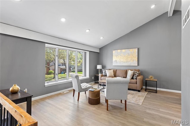1958 Cathedral Hill Dr, Saint Louis, MO 63138 - living room featuring light wood finished floors, recessed lighting, baseboards, and high vaulted ceiling