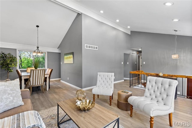 1958 Cathedral Hill Dr, Saint Louis, MO 63138 - living area featuring high vaulted ceiling, baseboards, light wood finished floors, recessed lighting, and a chandelier