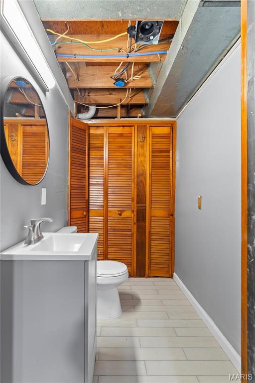 1958 Cathedral Hill Dr, Saint Louis, MO 63138 - bathroom featuring toilet and vanity