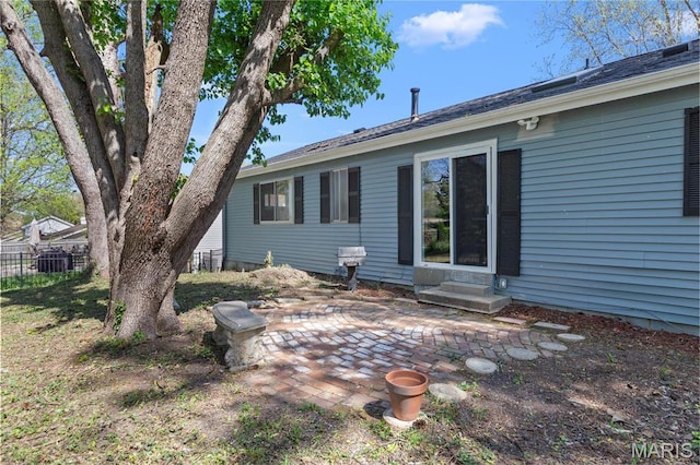 1958 Cathedral Hill Dr, Saint Louis, MO 63138 - back of property featuring entry steps, a patio area, fence, and central air condition unit